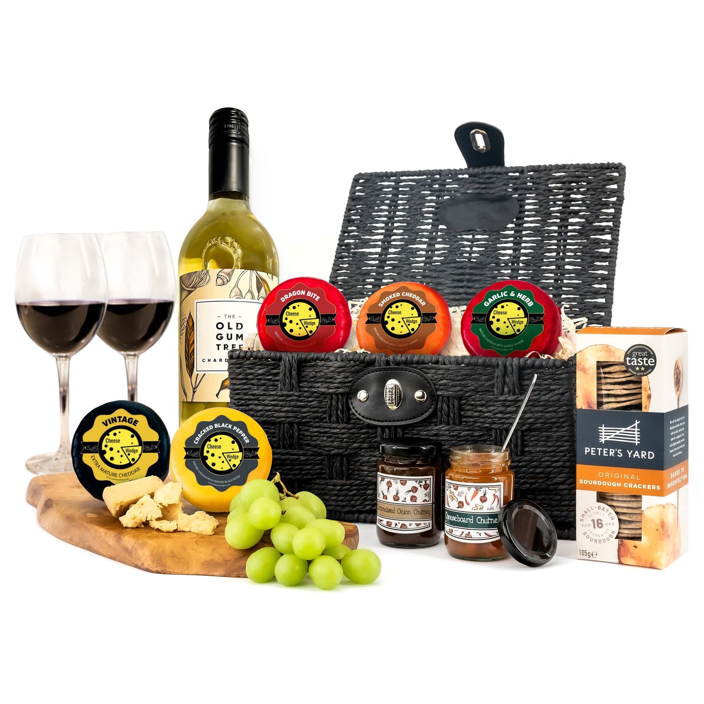 Presented in a woven black hamper, White Wine Cheese Truckle Hamper contains our best selling white wine, cheeses, chutney and includes a box of Peters Yard Sourdough crackers.