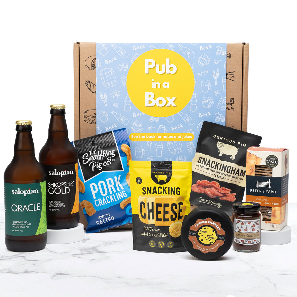 Experience the ultimate British pub with Pub In A Box. Indulge in a curated selection of classic pub snacks and refreshing beverages, including your choice of 2 Peroni Lagers or 2 Salopian Beer Ales. Enhance the flavours with our delicious accompaniments of Caramelised Onion Chutney and Peter's Yard Sourdough Crackers. Perfect for any pub enthusiast!